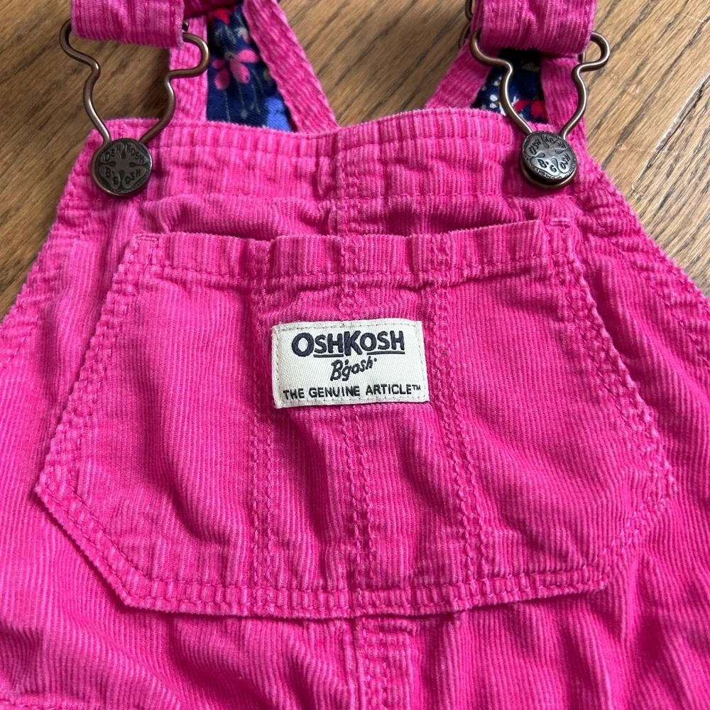 Pink OshKosh B'gosh corduroy overalls with floral lining on cuffs toddler girls